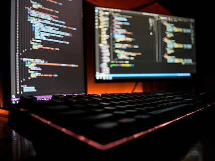 Computer screens showing code